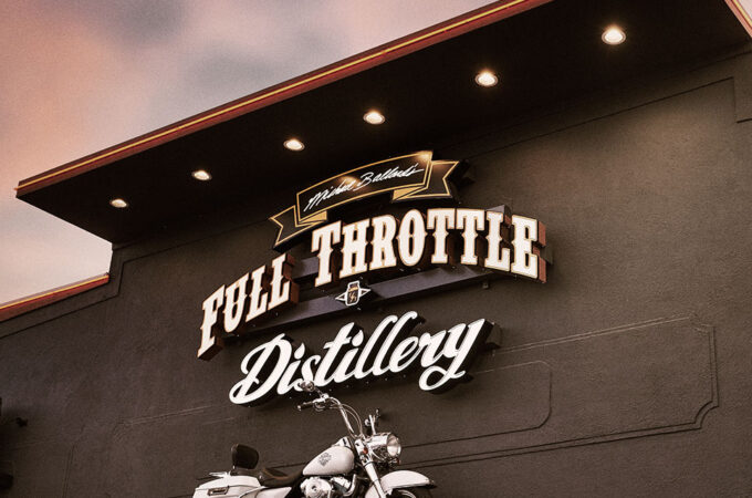 Full Throttle Distillery building sign with motorcycle mounted on wall in Branson, MO