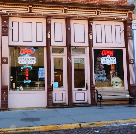 Historic storefront of Deadwood Distilling showcasing distillery tastings and local spirits in Deadwood, South Dakota.