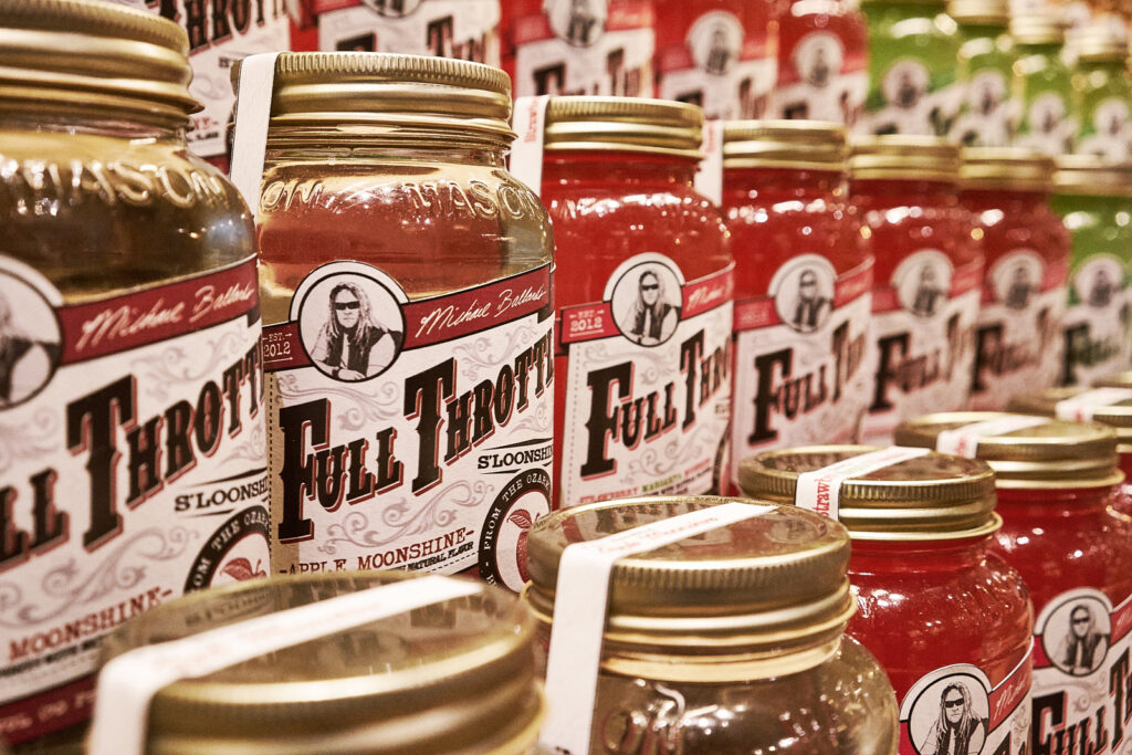 Jars of Full Throttle Moonshine in various flavors displayed at Deadwood Distilling Company