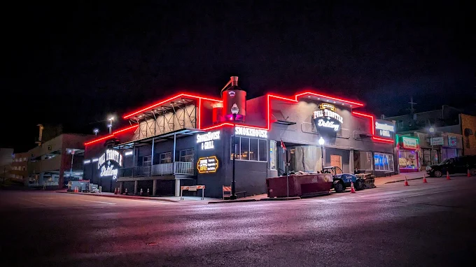 Full Throttle Distillery at night, showcasing the vibrant exterior lights, ideal for events you can host at Full Throttle Distillery.