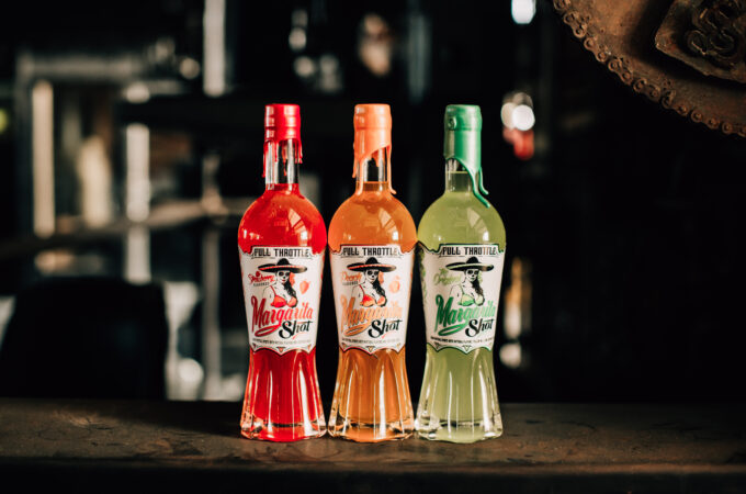 Full Throttle Margarita Shots trio of Strawberry, Peach, and Original flavors lined up on a bar.
