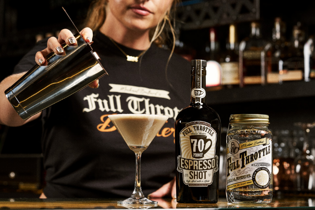 A bartender preparing a cocktail with Full Throttle Espresso Shot, showcasing our unique Special Spirits.