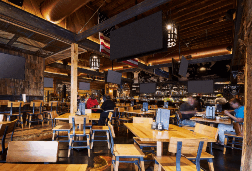 Interior dining room at Full Throttle Distillery showcasing a rustic setting for Dinner in Downtown Branson.