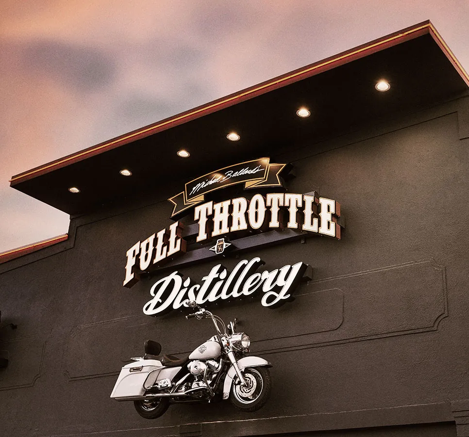 Full Throttle Distillery building sign with motorcycle mounted on wall in Branson, MO